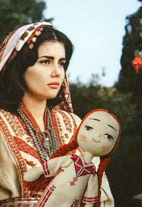 Ayadi by Widad campaign — woman in traditional dress holding the doll